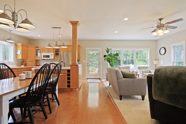 5200 N Locust Grove Church Rd, Columbia, MO 65202 - dining area with ceiling fan, recessed lighting, light wood-type flooring, ornate columns, and a chandelier