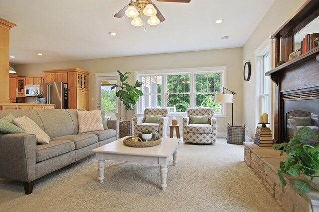 5200 N Locust Grove Church Rd, Columbia, MO 65202 - living room featuring a ceiling fan, recessed lighting, light carpet, and a glass covered fireplace