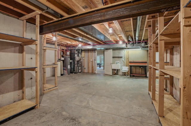 3904 Ivanhoe Blvd, Columbia, MO 65203 - unfinished below grade area with water heater, a water softener system, and heating unit