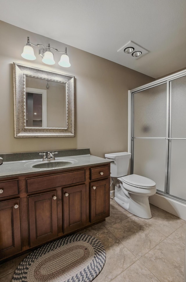 3904 Ivanhoe Blvd, Columbia, MO 65203 - bathroom featuring vanity, a shower stall, and tile patterned flooring