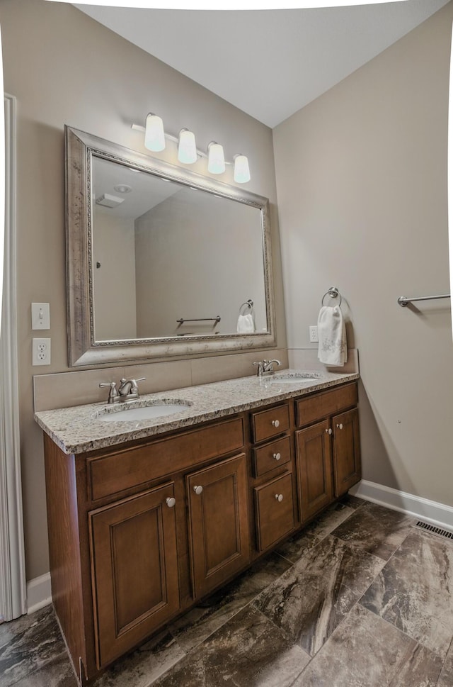 3904 Ivanhoe Blvd, Columbia, MO 65203 - full bathroom featuring double vanity and marble finish flooring