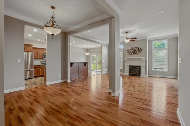3904 Ivanhoe Blvd, Columbia, MO 65203 - unfurnished living room with light wood-style flooring, ornamental molding, ceiling fan, a fireplace, and recessed lighting