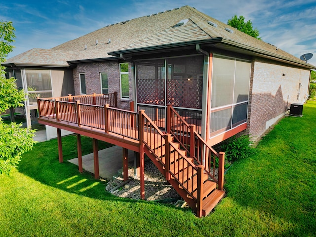 3904 Ivanhoe Blvd, Columbia, MO 65203 - back of house with a sunroom, brick siding, a yard, a deck, and a shingled roof