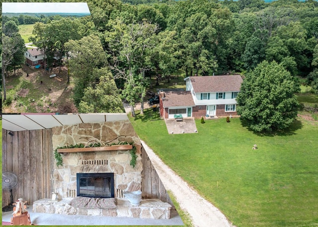 3674 State Road Aa, Holts Summit, MO 65043 - aerial view of property and surrounding area featuring a heavily wooded area