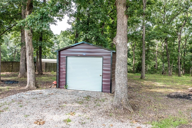 3674 State Road Aa, Holts Summit, MO 65043 - garage featuring a storage shed