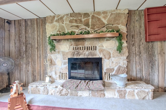 3674 State Road Aa, Holts Summit, MO 65043 - detailed view of wooden walls, a stone fireplace, and carpet floors
