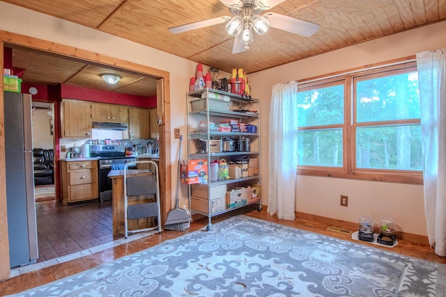 3674 State Road Aa, Holts Summit, MO 65043 - kitchen with stainless steel electric range, a ceiling fan, under cabinet range hood, wooden ceiling, and brown cabinets