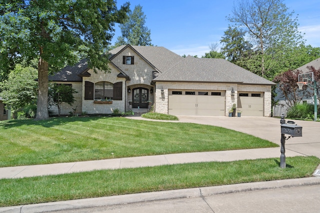5809 Morning Star Ct, Columbia, MO 65203 - french country style house featuring a garage, stone siding, concrete driveway, a front yard, and roof with shingles