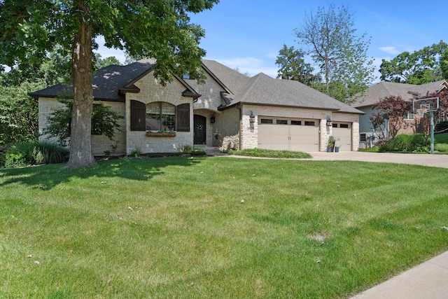 5809 Morning Star Ct, Columbia, MO 65203 - french country style house featuring stone siding, an attached garage, a front yard, driveway, and a shingled roof