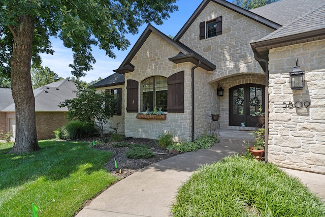 5809 Morning Star Ct, Columbia, MO 65203 - view of front of property featuring stone siding, french doors, a shingled roof, and a front yard