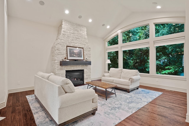 5809 Morning Star Ct, Columbia, MO 65203 - living area with a stone fireplace, wood finished floors, lofted ceiling, and recessed lighting
