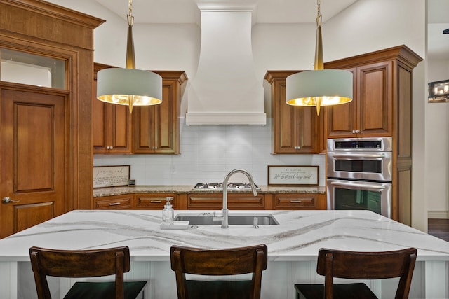 5809 Morning Star Ct, Columbia, MO 65203 - kitchen with stainless steel appliances, premium range hood, brown cabinetry, decorative backsplash, and light stone countertops