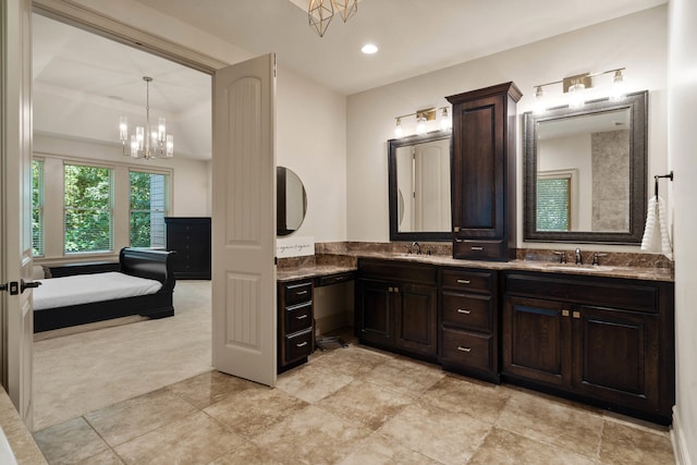 5809 Morning Star Ct, Columbia, MO 65203 - ensuite bathroom with double vanity, a chandelier, a tray ceiling, and recessed lighting