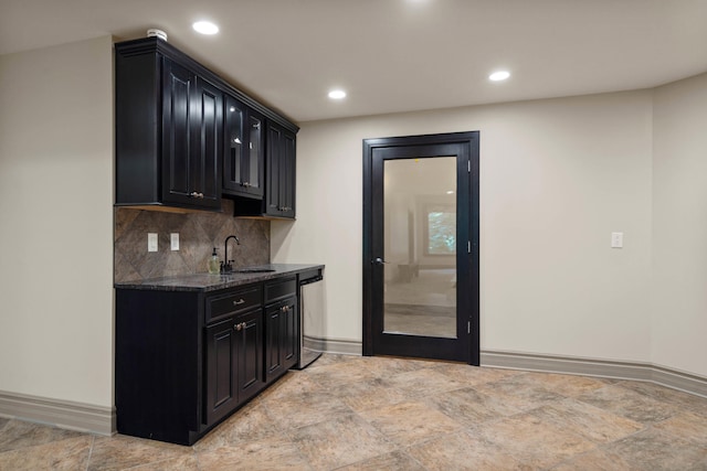 5809 Morning Star Ct, Columbia, MO 65203 - bar featuring stainless steel dishwasher, decorative backsplash, recessed lighting, and light stone finish flooring