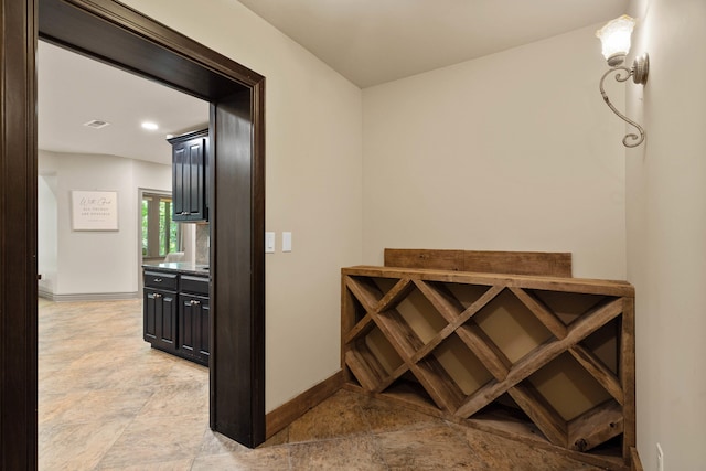5809 Morning Star Ct, Columbia, MO 65203 - wine cellar featuring baseboards and light stone finish floors