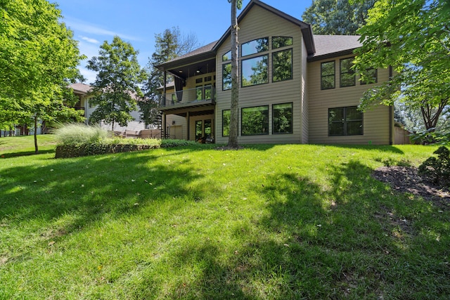 5809 Morning Star Ct, Columbia, MO 65203 - back of property with a balcony, a lawn, and a shingled roof