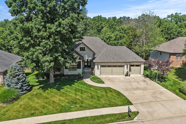 5809 Morning Star Ct, Columbia, MO 65203 - french provincial home featuring a garage, driveway, a front lawn, stone siding, and a shingled roof