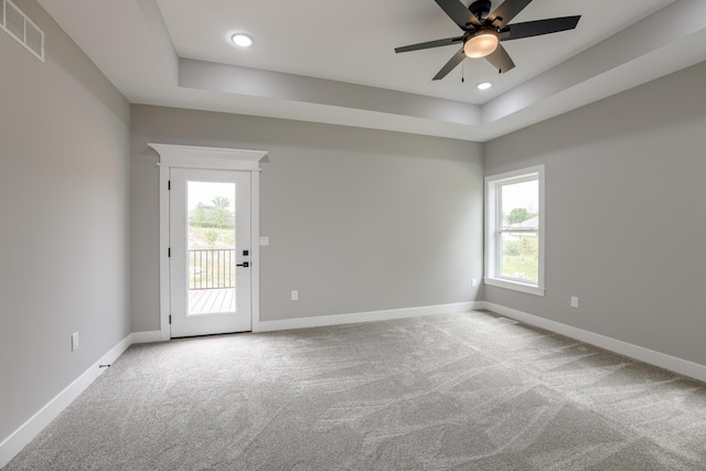 4305 Peregrine Pl, Columbia, MO 65202 - spare room with carpet floors, ceiling fan, a tray ceiling, and recessed lighting