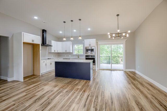 4305 Peregrine Pl, Columbia, MO 65202 - kitchen with appliances with stainless steel finishes, wall chimney range hood, light wood finished floors, light countertops, and lofted ceiling