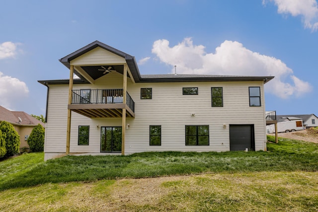 4305 Peregrine Pl, Columbia, MO 65202 - rear view of property with a balcony, a garage, ceiling fan, and a yard