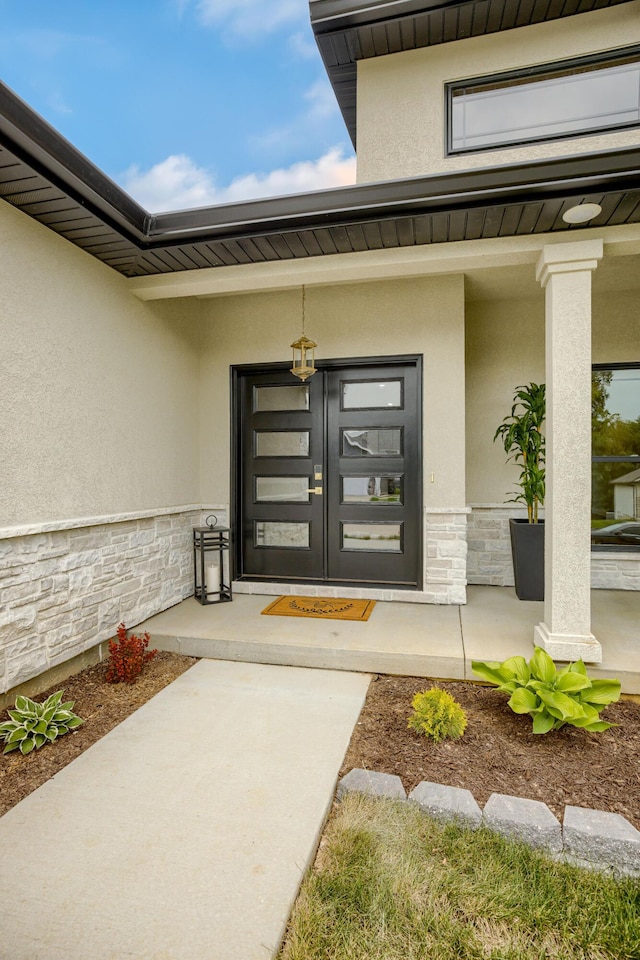 4305 Peregrine Pl, Columbia, MO 65202 - doorway to property with stone siding and stucco siding