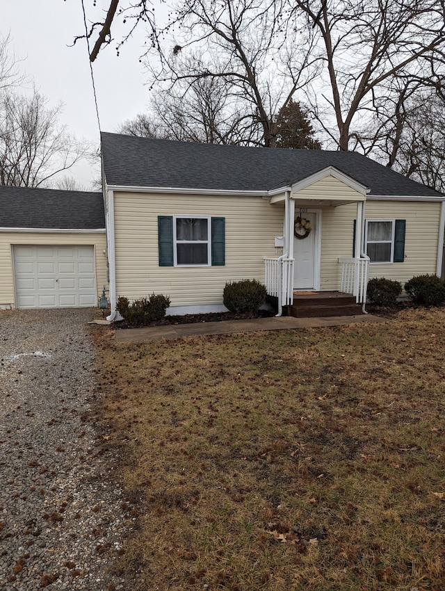 505 W Worley St, Columbia, MO 65203 - view of front of home featuring a garage, driveway, roof with shingles, and a front lawn