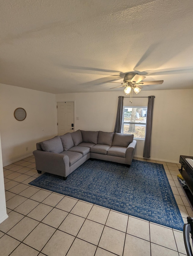 505 W Worley St, Columbia, MO 65203 - living area with ceiling fan, a textured ceiling, and light tile patterned flooring