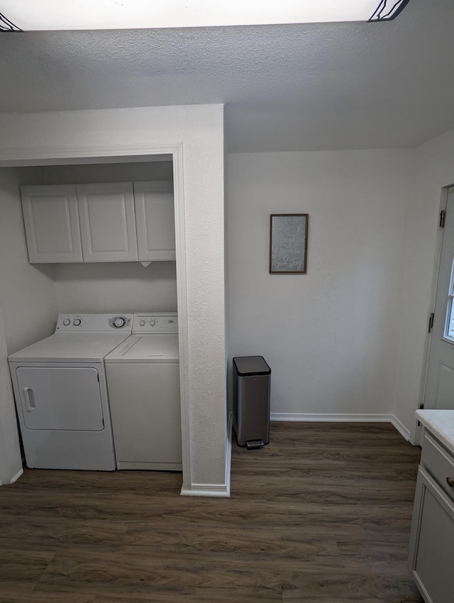 505 W Worley St, Columbia, MO 65203 - laundry room featuring washing machine and clothes dryer, dark wood-type flooring, and cabinet space