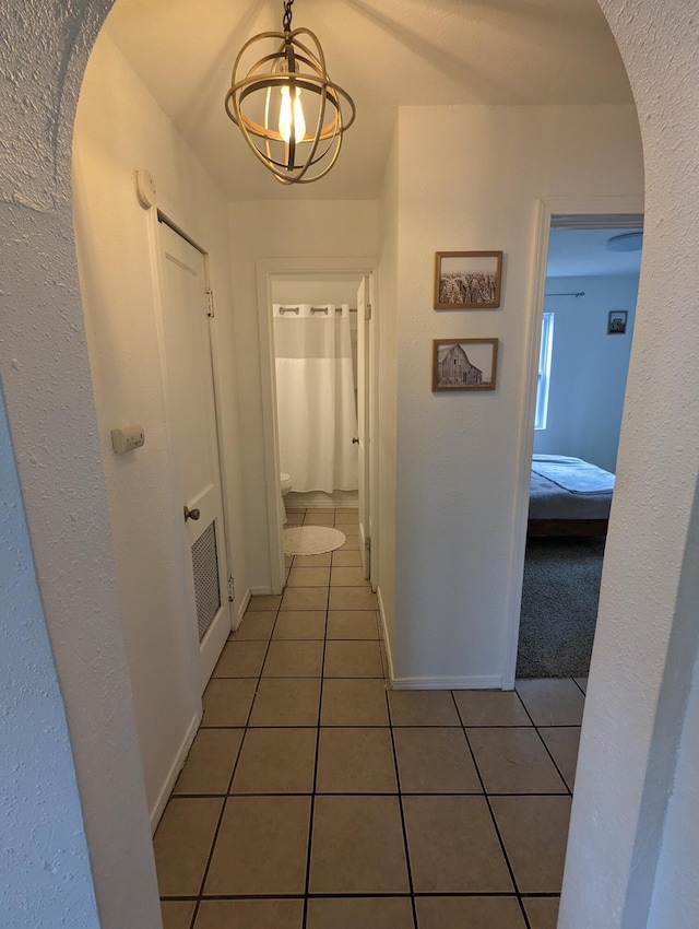 505 W Worley St, Columbia, MO 65203 - corridor featuring tile patterned floors, arched walkways, and a chandelier