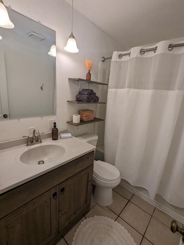 505 W Worley St, Columbia, MO 65203 - full bath with tile patterned flooring, vanity, and a shower with shower curtain