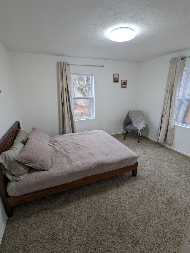 505 W Worley St, Columbia, MO 65203 - carpeted bedroom featuring a textured ceiling
