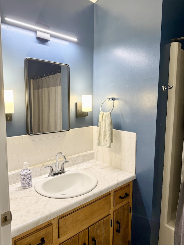 3900 E Christian School Rd, Hartsburg, MO 65039 - bathroom with vanity and decorative backsplash