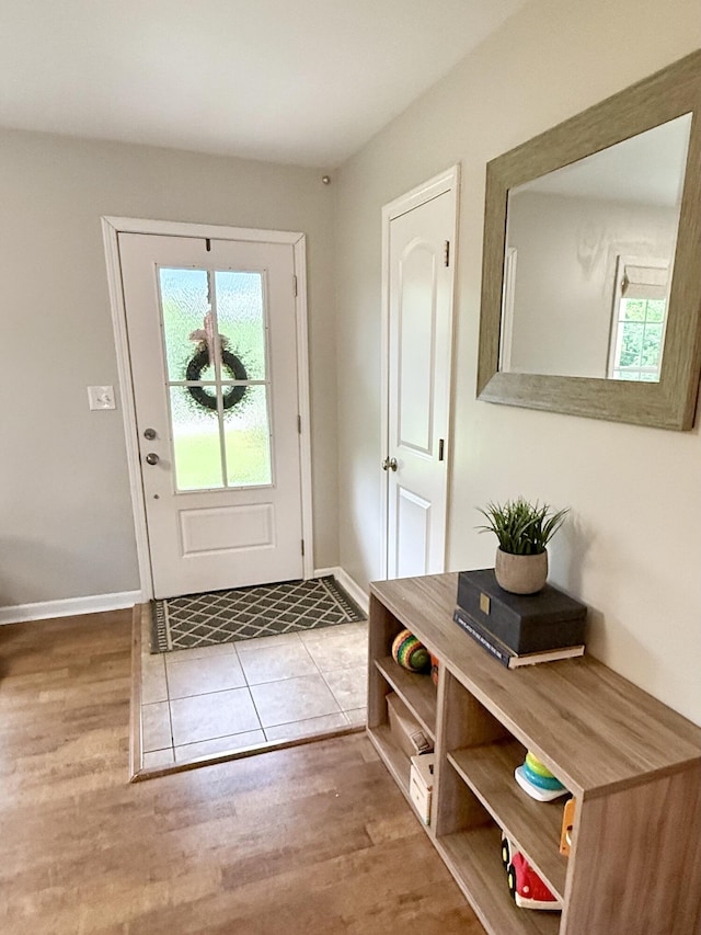 3900 E Christian School Rd, Hartsburg, MO 65039 - doorway to outside featuring wood finished floors and baseboards