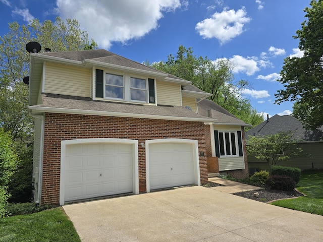 3109 Appalachian Dr, Columbia, MO 65203 - view of front facade featuring driveway, brick siding, and roof with shingles