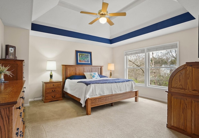 3109 Appalachian Dr, Columbia, MO 65203 - bedroom featuring a raised ceiling, light carpet, and a ceiling fan