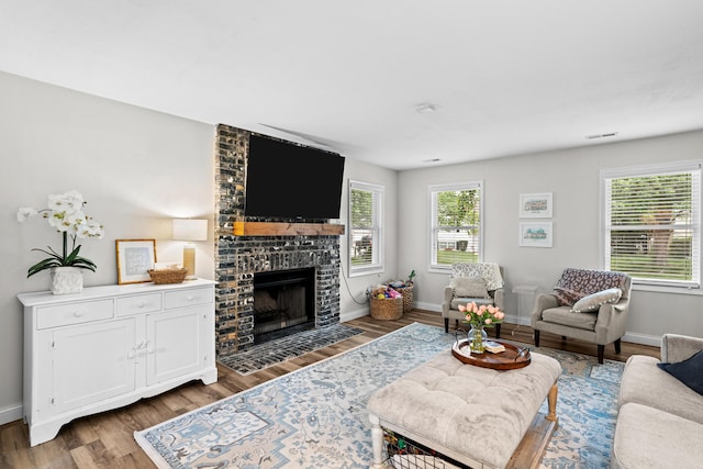 1500 Glencairn Ct, Columbia, MO 65203 - living room featuring wood finished floors and a fireplace