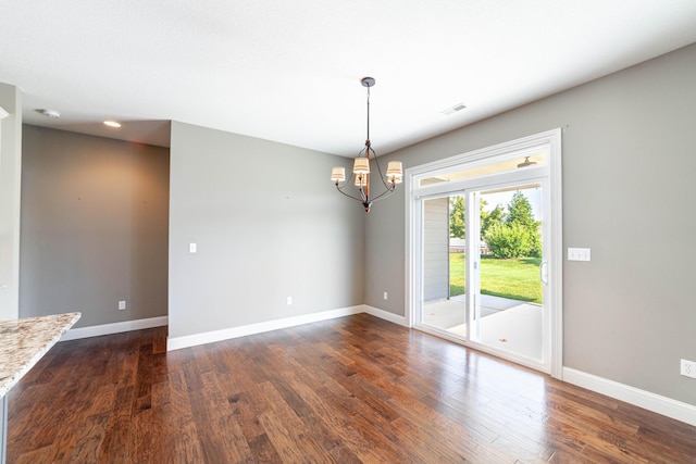 1915 Muirfield Dr, Columbia, MO 65203 - unfurnished room featuring dark wood-type flooring and a chandelier