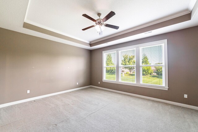 1915 Muirfield Dr, Columbia, MO 65203 - carpeted empty room with a raised ceiling, a ceiling fan, and ornamental molding