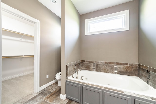 1915 Muirfield Dr, Columbia, MO 65203 - full bathroom featuring a jetted tub and a walk in closet