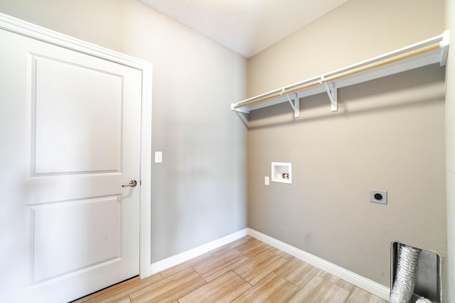 1915 Muirfield Dr, Columbia, MO 65203 - laundry area with hookup for an electric dryer, light wood-style flooring, and hookup for a washing machine
