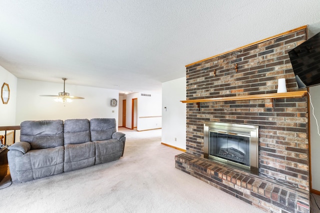 6002 E Molly Ln, Columbia, MO 65202 - living room featuring carpet flooring, a brick fireplace, a textured ceiling, and ceiling fan