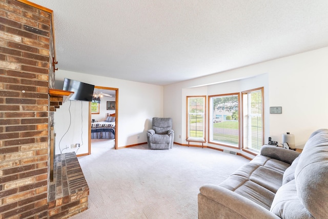 6002 E Molly Ln, Columbia, MO 65202 - living area with carpet and a textured ceiling