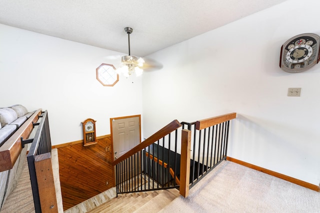 6002 E Molly Ln, Columbia, MO 65202 - stairs featuring a ceiling fan and carpet