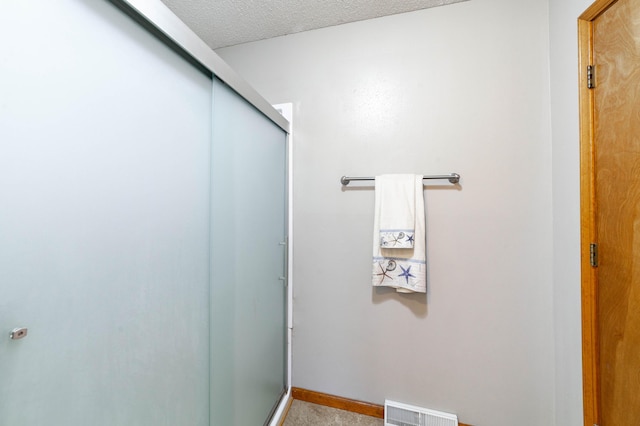 6002 E Molly Ln, Columbia, MO 65202 - full bath with a shower stall and a textured ceiling