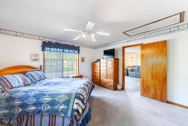 6002 E Molly Ln, Columbia, MO 65202 - bedroom with carpet floors, attic access, a textured ceiling, and ceiling fan