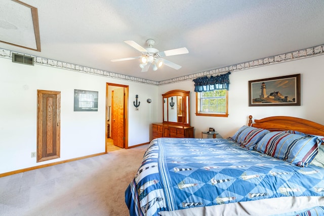 6002 E Molly Ln, Columbia, MO 65202 - bedroom with light carpet, a textured ceiling, and a ceiling fan