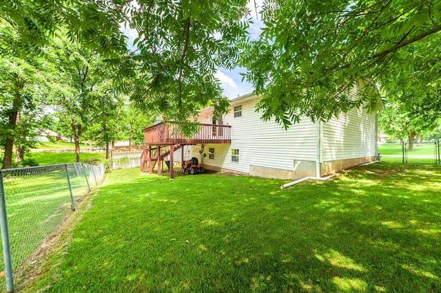 6002 E Molly Ln, Columbia, MO 65202 - fenced backyard with stairs, a wooden deck, and a gate