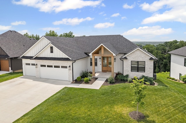 605 Angels Rest Way, Columbia, MO 65203 - modern farmhouse featuring french doors, board and batten siding, stone siding, an attached garage, and a front lawn