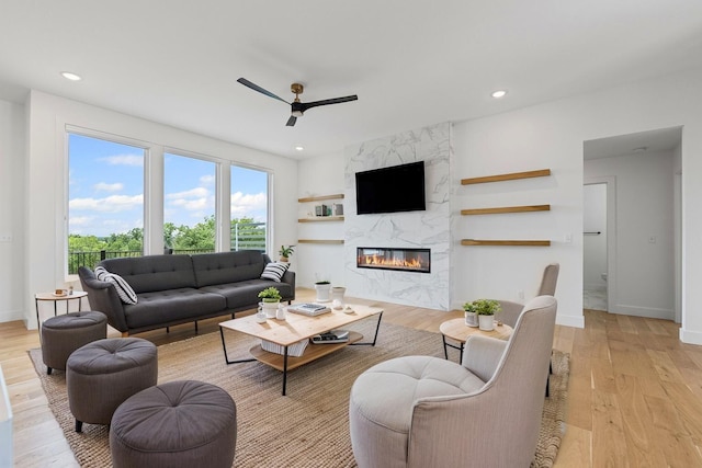 605 Angels Rest Way, Columbia, MO 65203 - living room with ceiling fan, a high end fireplace, light wood-type flooring, recessed lighting, and built in features