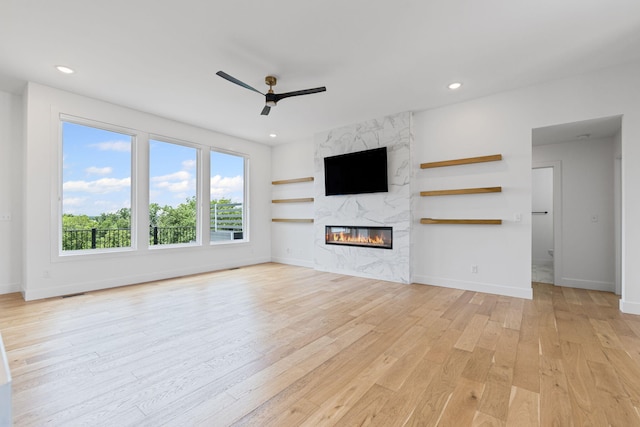 605 Angels Rest Way, Columbia, MO 65203 - unfurnished living room featuring light wood finished floors, a ceiling fan, a fireplace, and recessed lighting